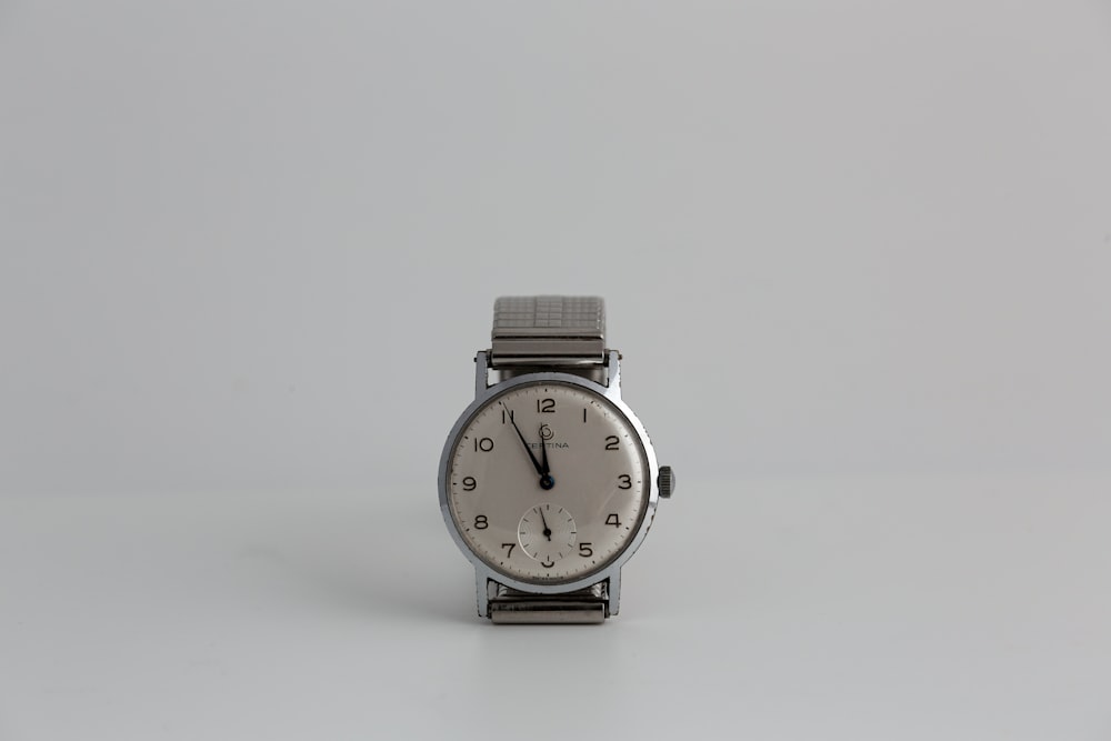 silver and white analog watch
