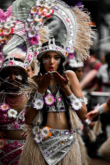 woman in white and purple floral hat and white and black floral dress