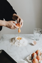 person holding a white cream