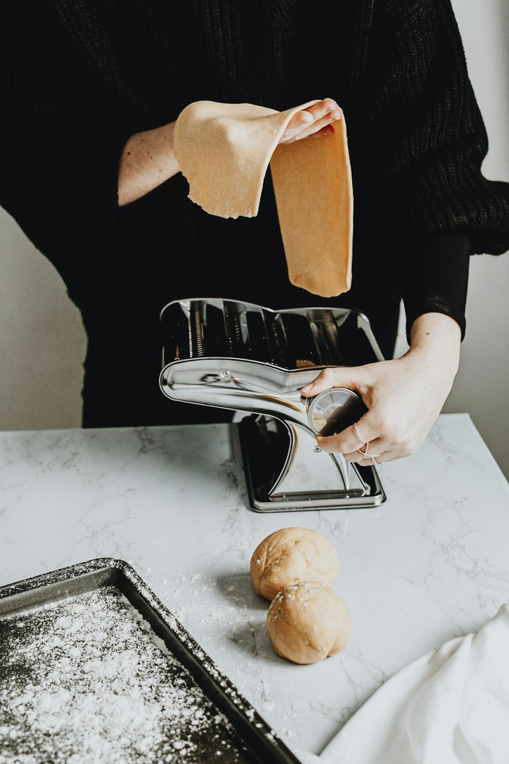person holding stainless steel bread knife