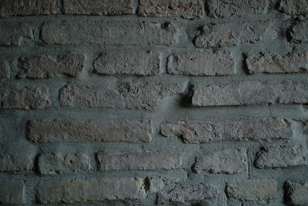 grey brick wall during daytime