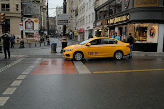 yellow car on road during daytime