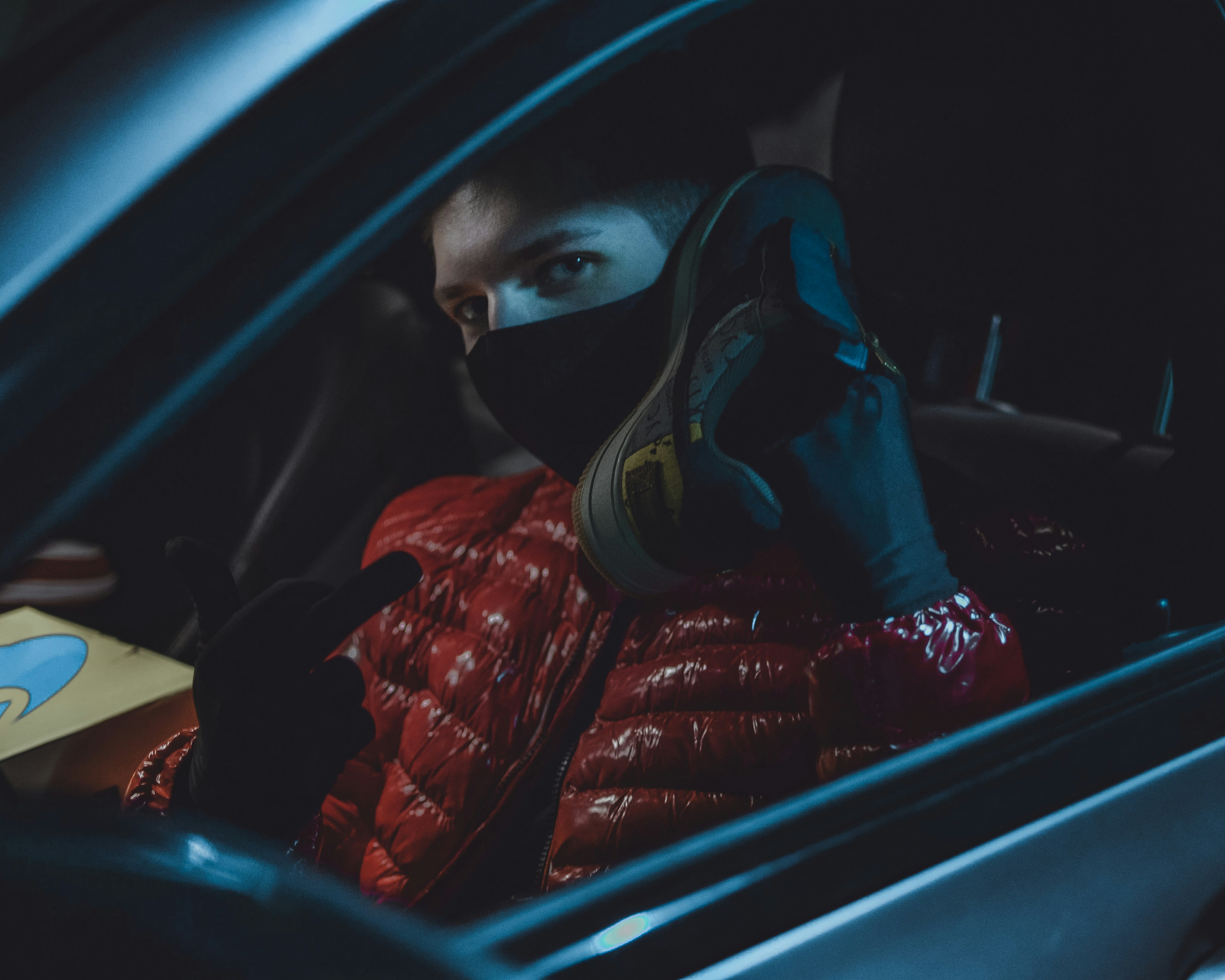 person in red and black jacket wearing black goggles