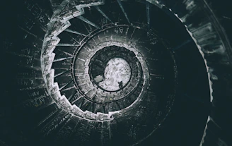 An evocative image of a spiral staircase symbolizing the journey through past lives.