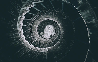 An evocative image of a spiral staircase symbolizing the journey through past lives.