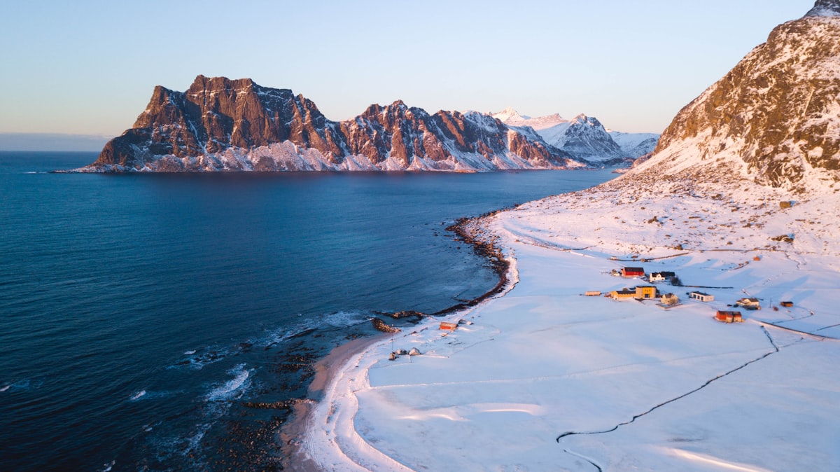 Vestvågøy Lofoten — Haukland beach with turquoise water and white sand under midnight sun