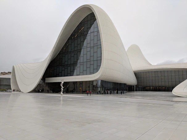 A contemporary cultural center with sweeping curves and a spacious outdoor plaza.