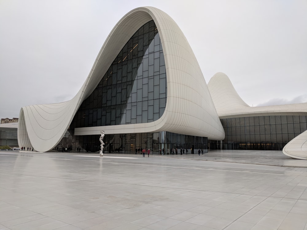 people walking on white concrete building