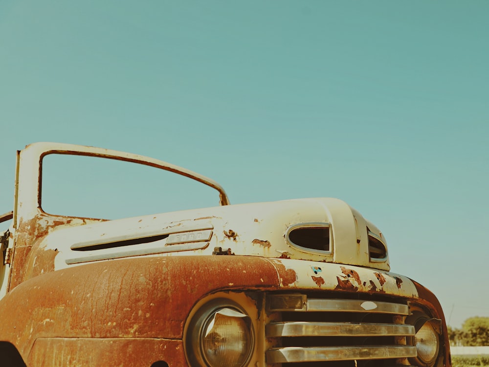 brown car under blue sky during daytime