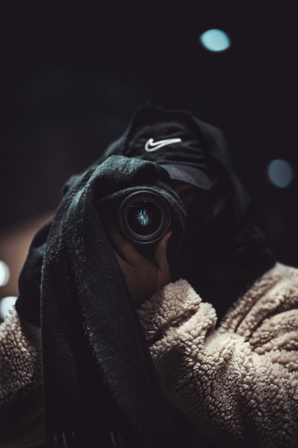 black camera lens on gray textile