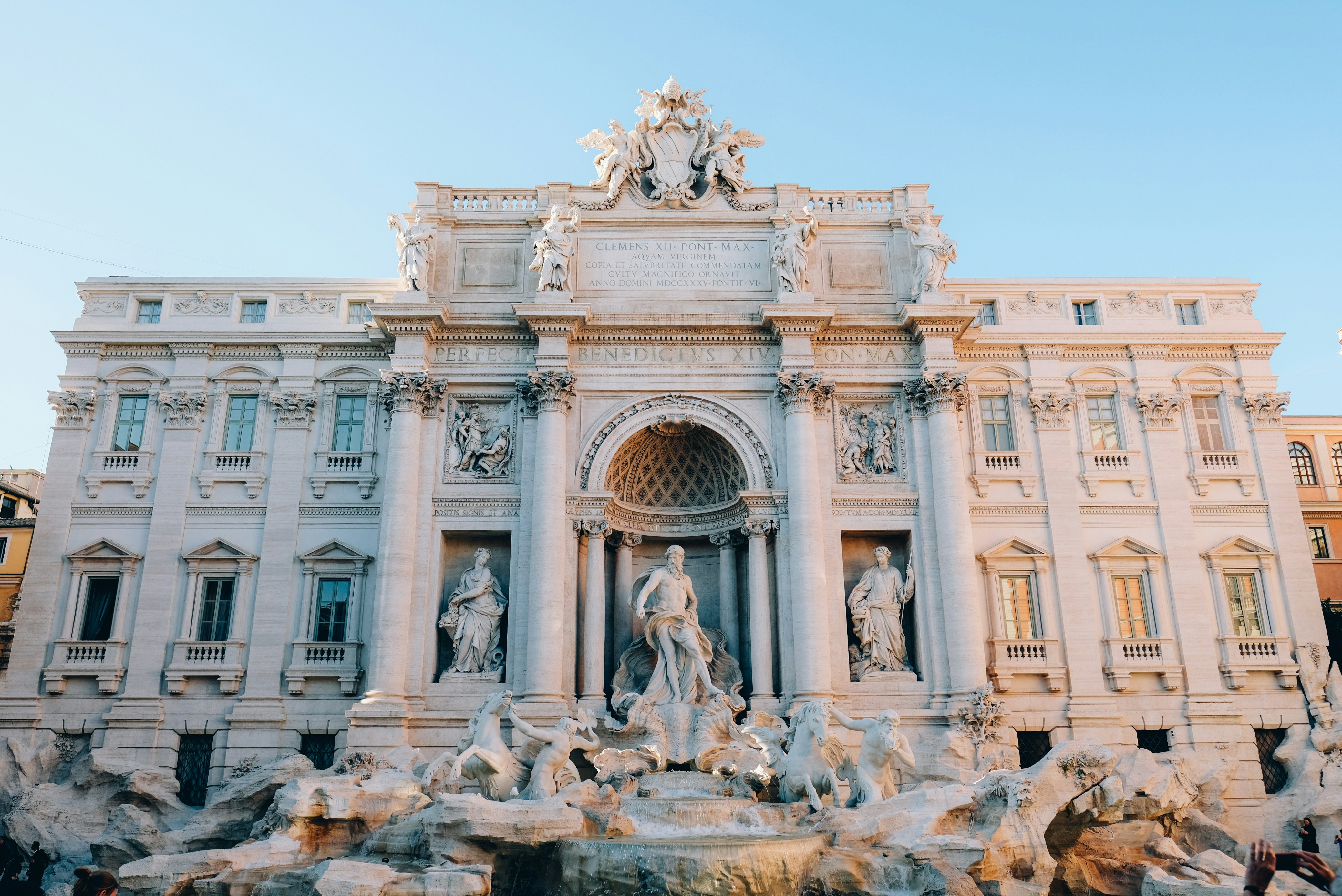 white concrete building with statues, Fontana di Trevi</p><p>Rome, Italy