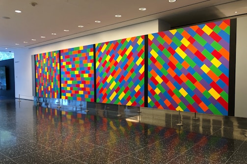 Gallery view showcasing multiple painted panels with vibrant colors.