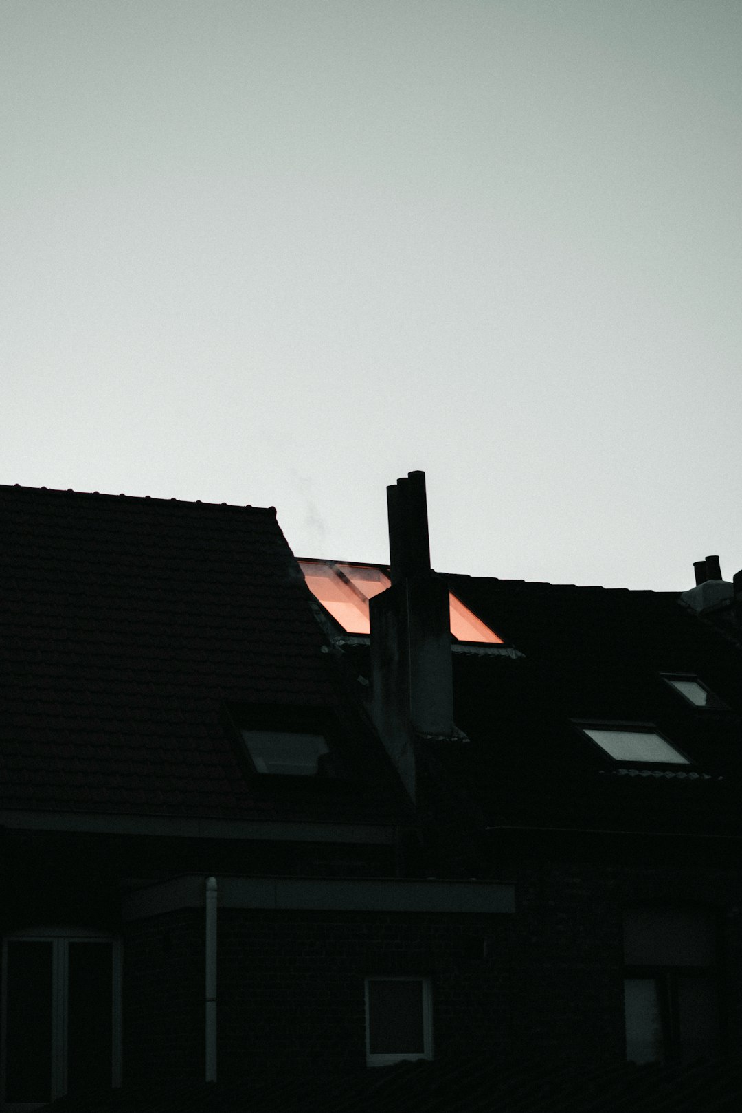 black and orange building under gray sky