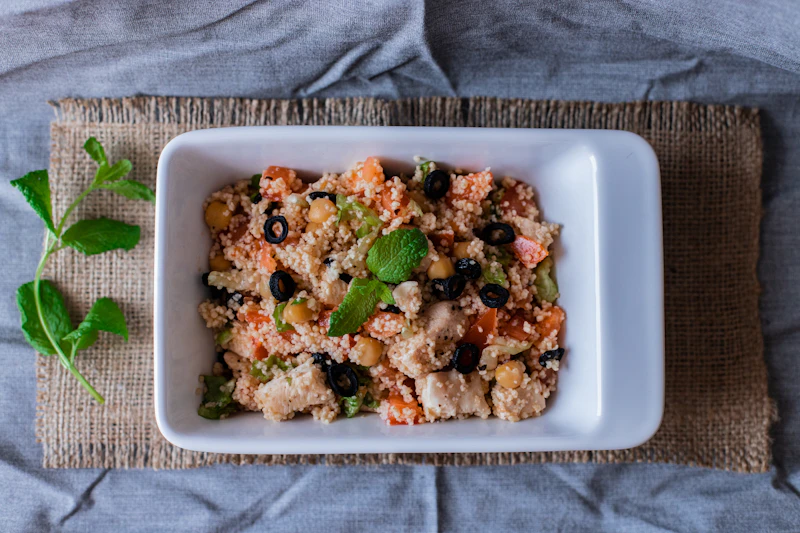A prepared meal portioned into a container