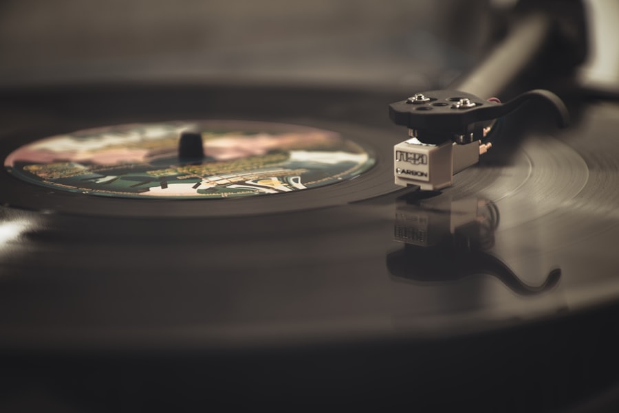 A vinyl record spinning on a turntable with warm lighting
