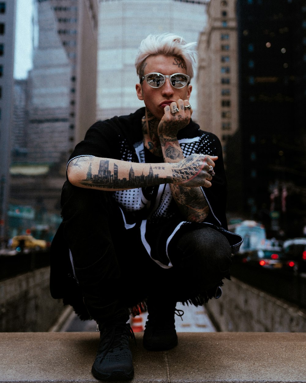 man in black and white long sleeve shirt wearing sunglasses