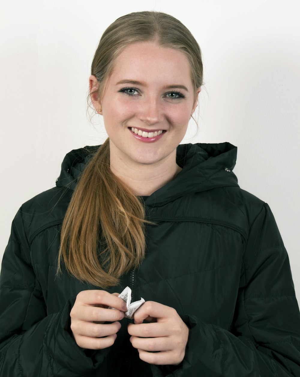 woman in black jacket smiling