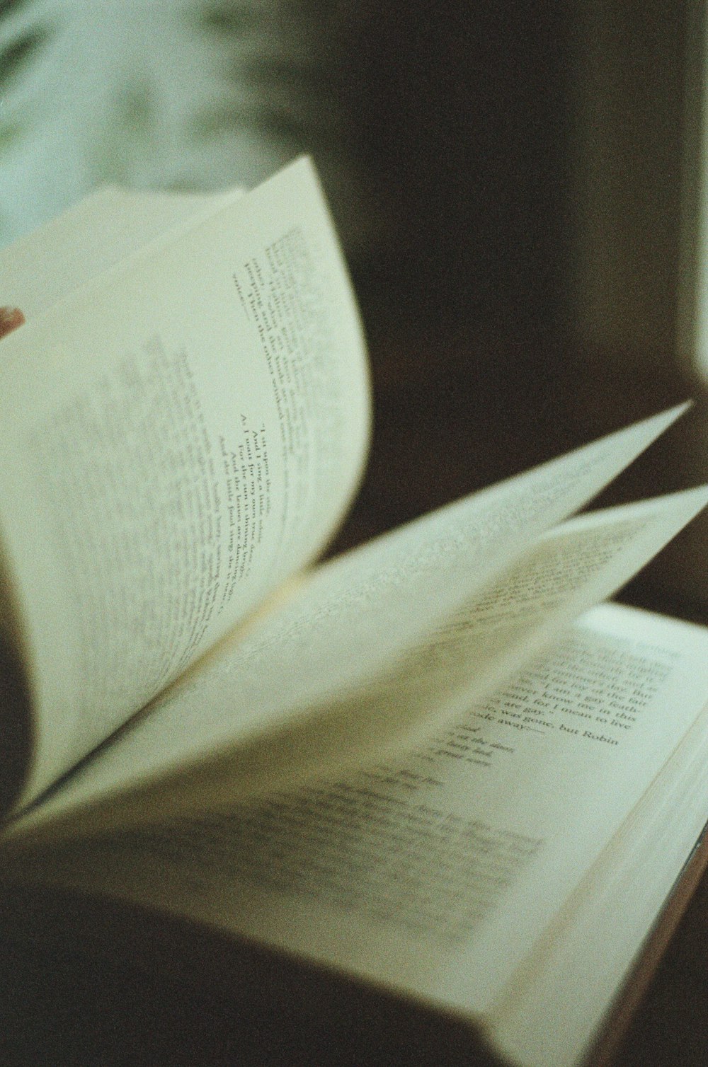 white book page on brown wooden table