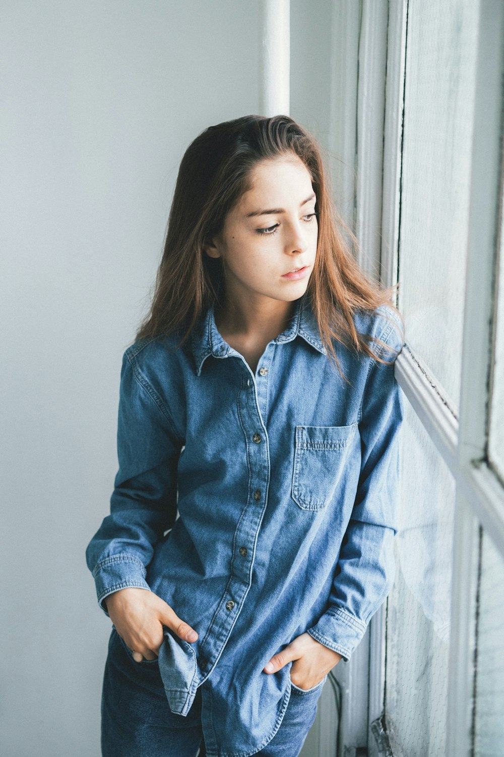 woman in blue denim button up jacket