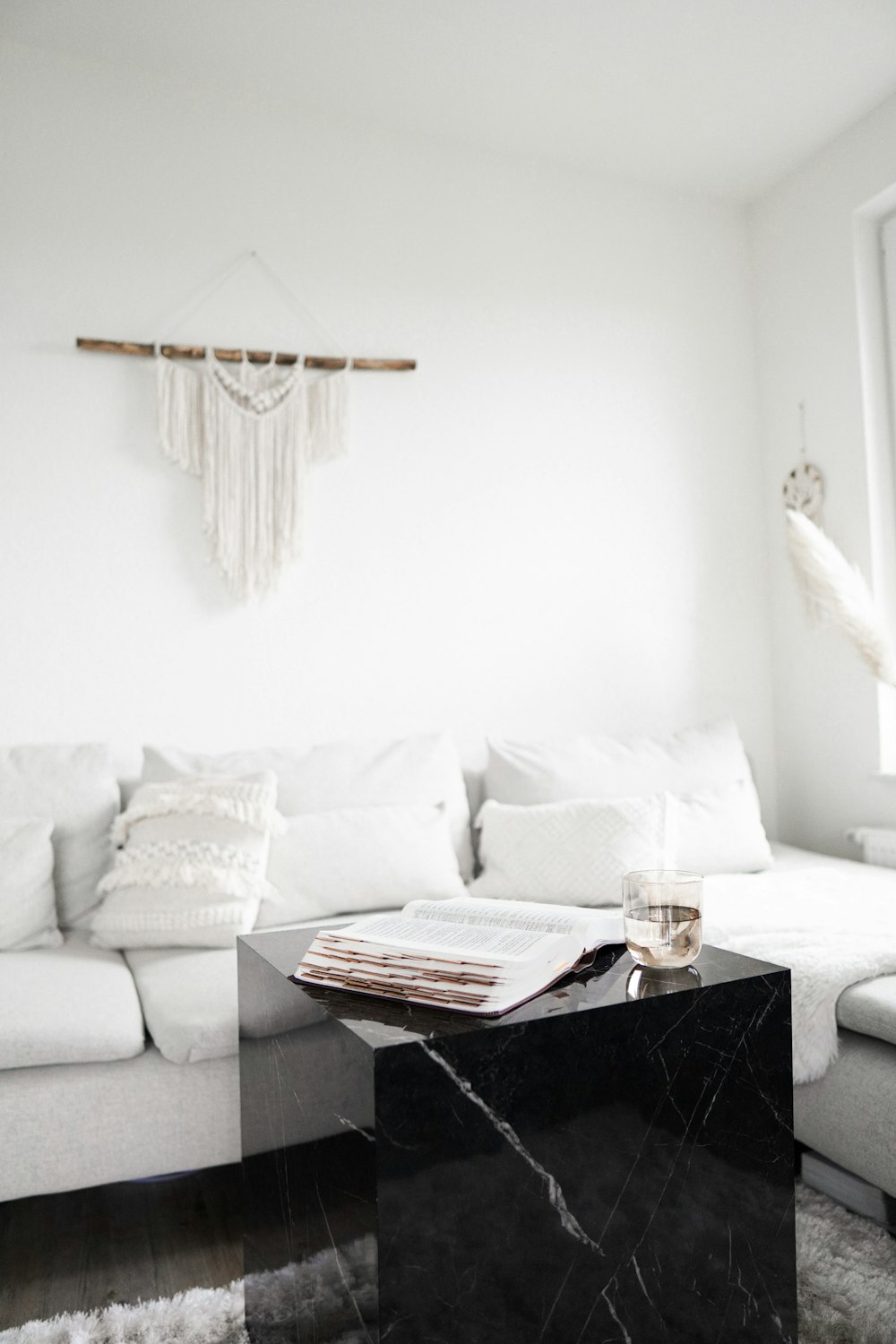 black wooden table near white sofa