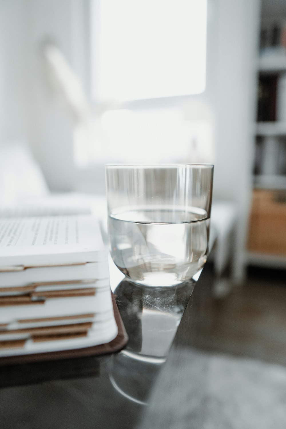 clear drinking glass on brown wooden table