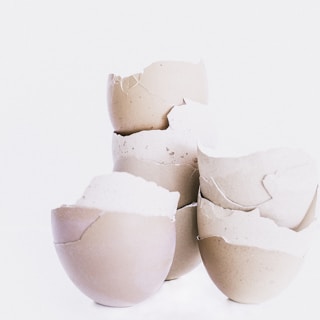 Close-up of a sleek, minimalistic design inwaste desk accessory made from finely crushed eggshells.
