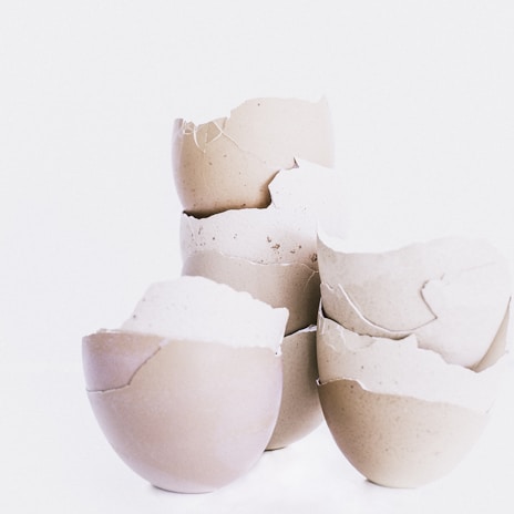 Close-up of a sleek, minimalistic design inwaste desk accessory made from finely crushed eggshells.