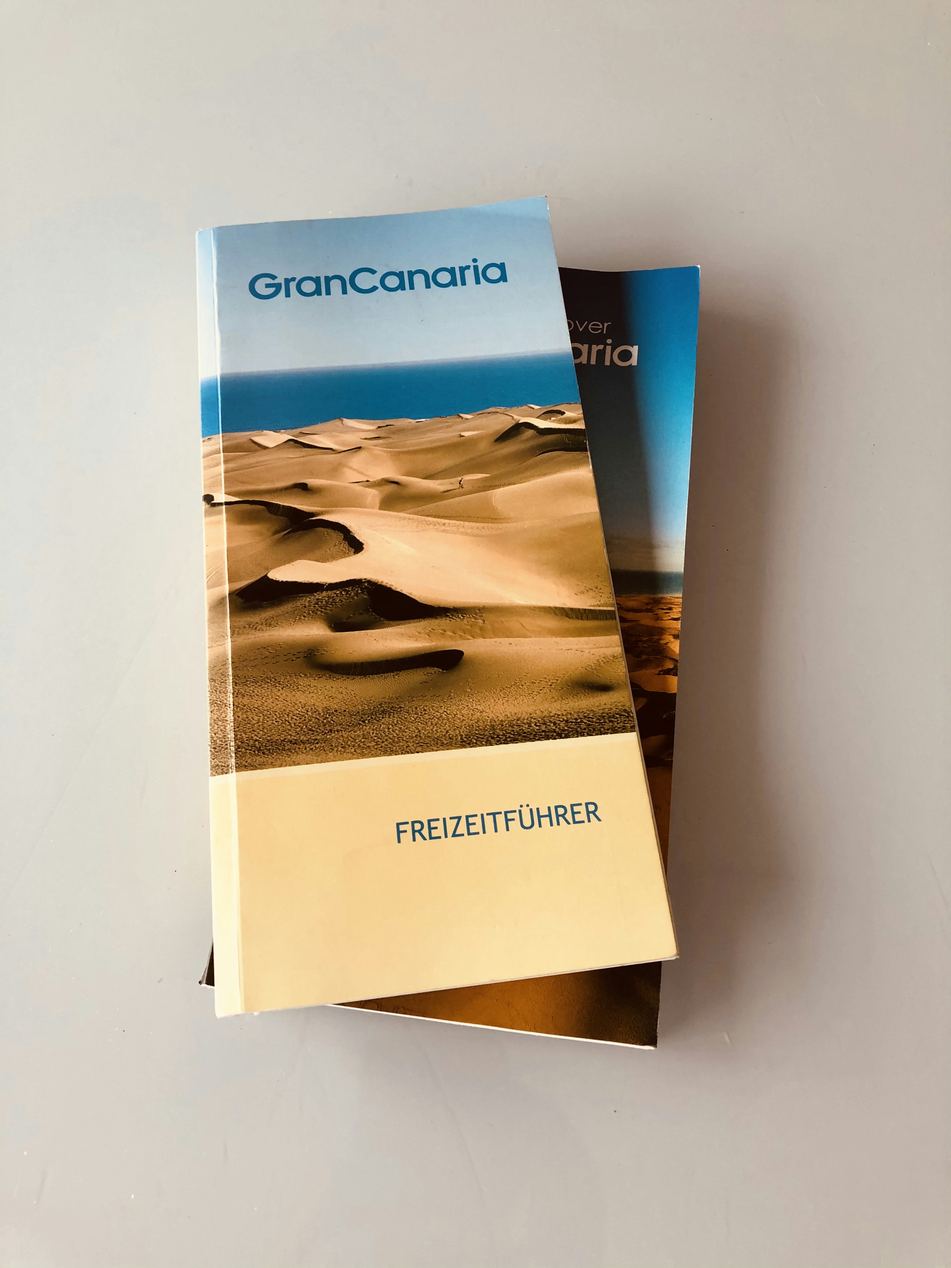 blue and white labeled book