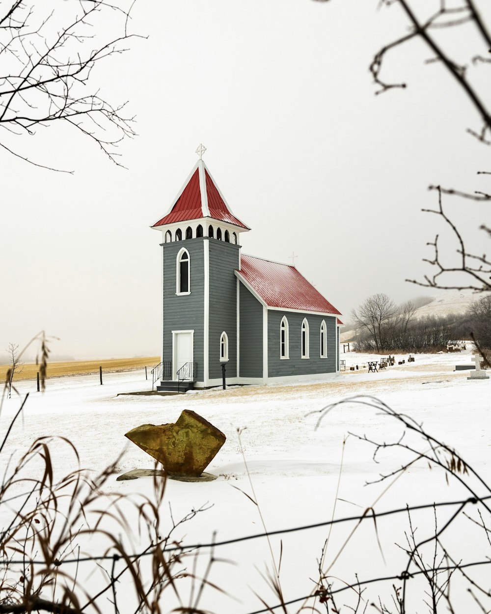 white and black concrete building near bare trees during daytime