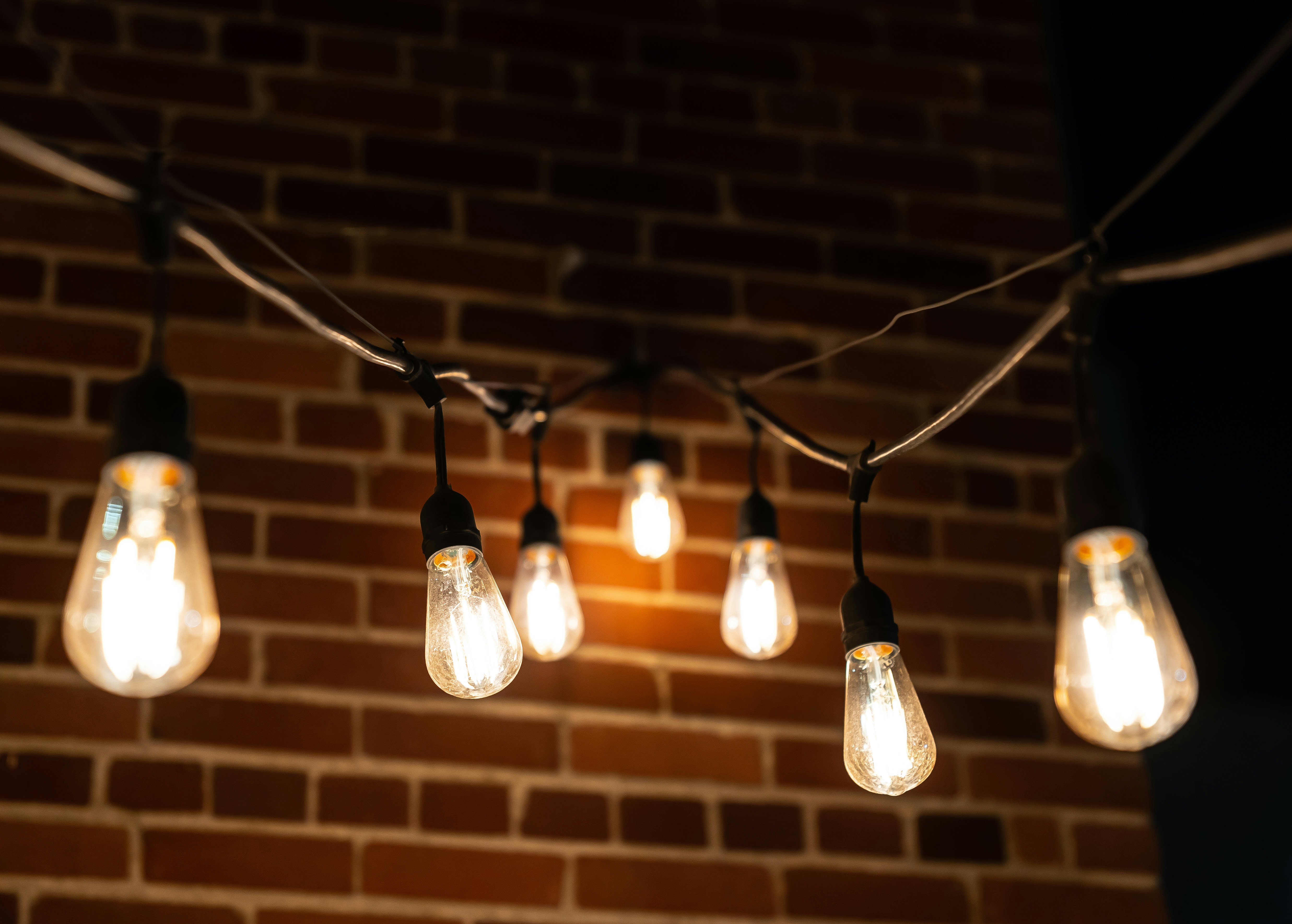 Lights along a string outside a bar downtown.