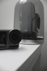 DJI action camera held by a user preparing for an extreme sport.