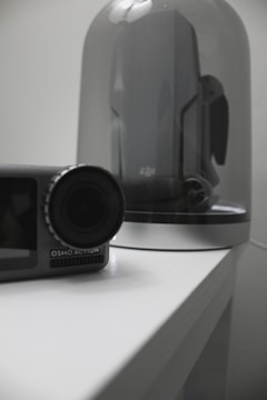 DJI action camera held by a user preparing for an extreme sport.