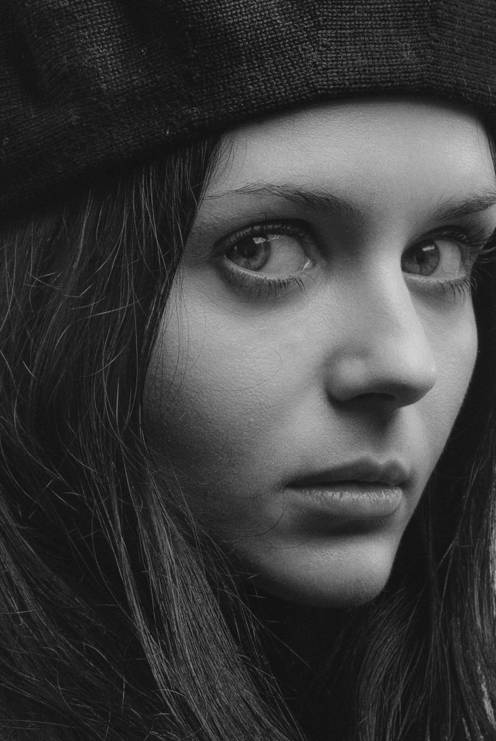 grayscale photo of womans face