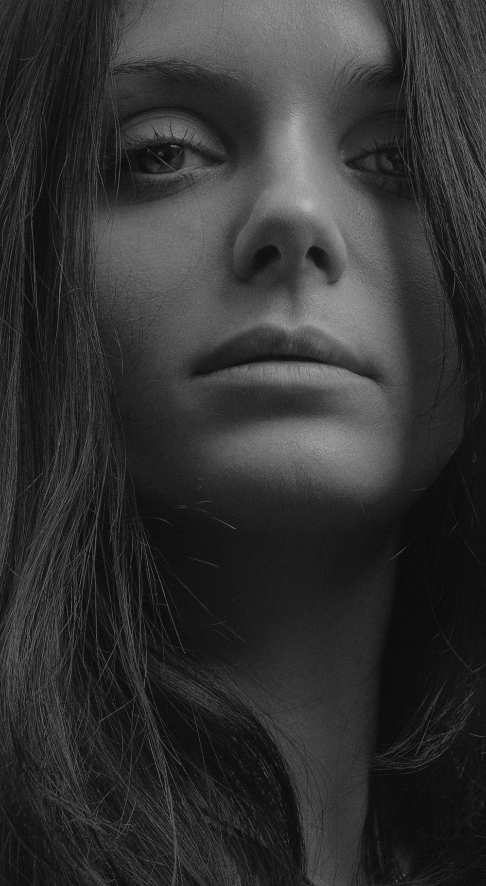 grayscale photo of womans face