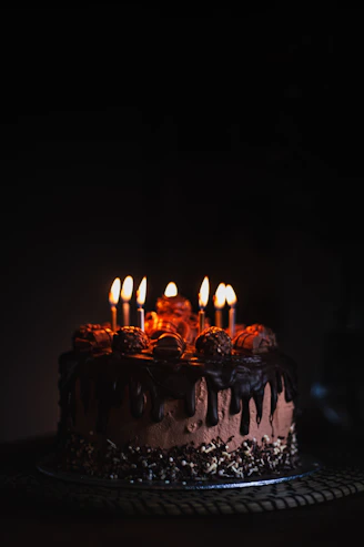 lighted candles on black metal stand