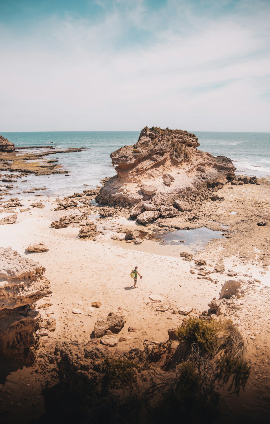 brown rock formation on beach during daytime