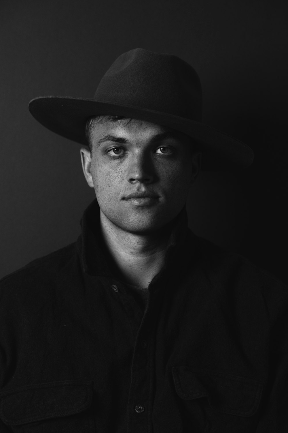 man in black hat and black button up shirt