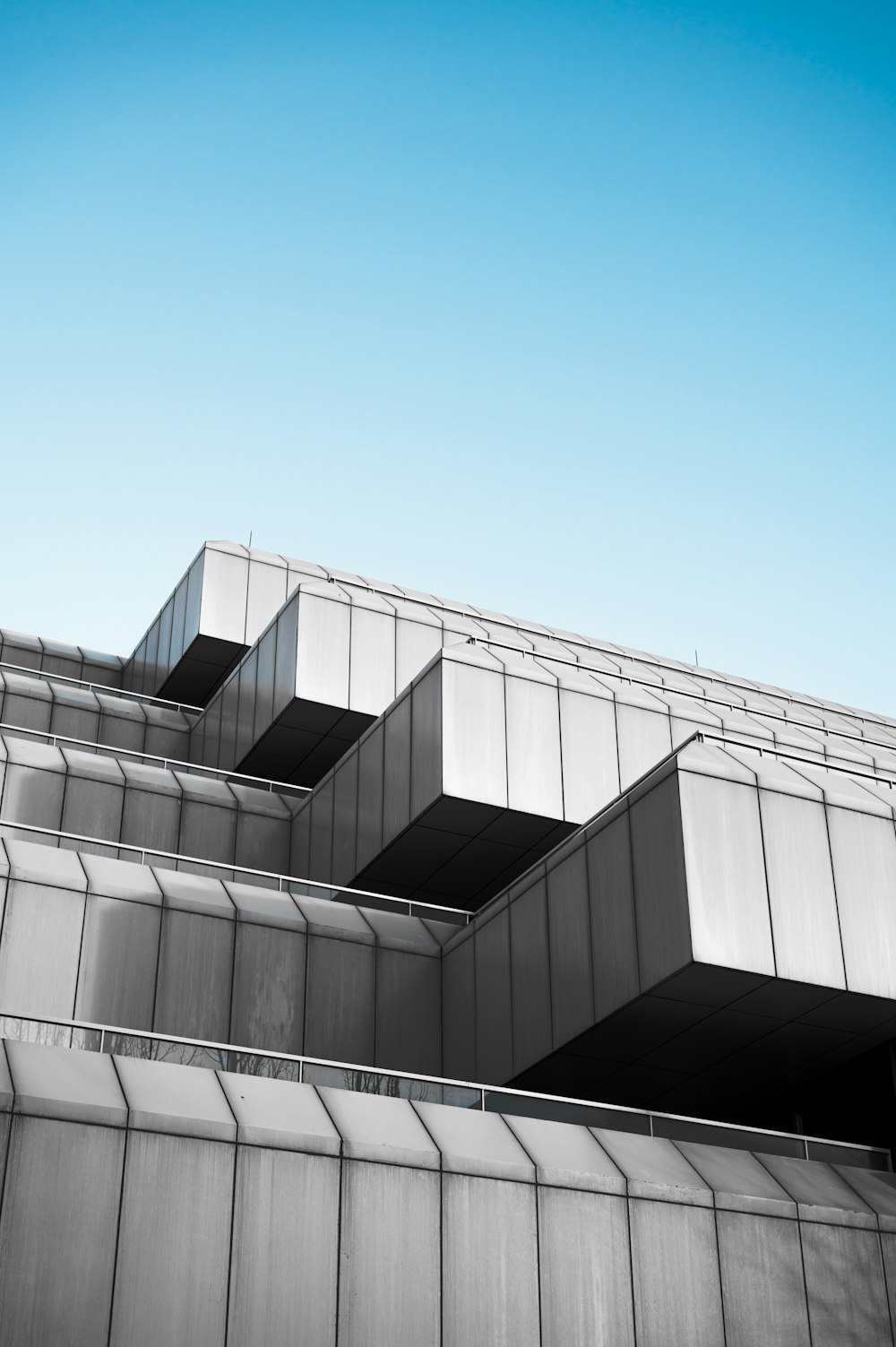 white concrete building under blue sky during daytime