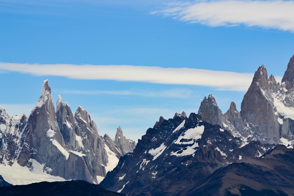 snow covered mountain under blue sky during daytime