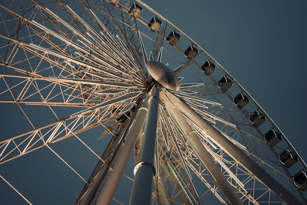 white ferris wheel under blue sky during daytime