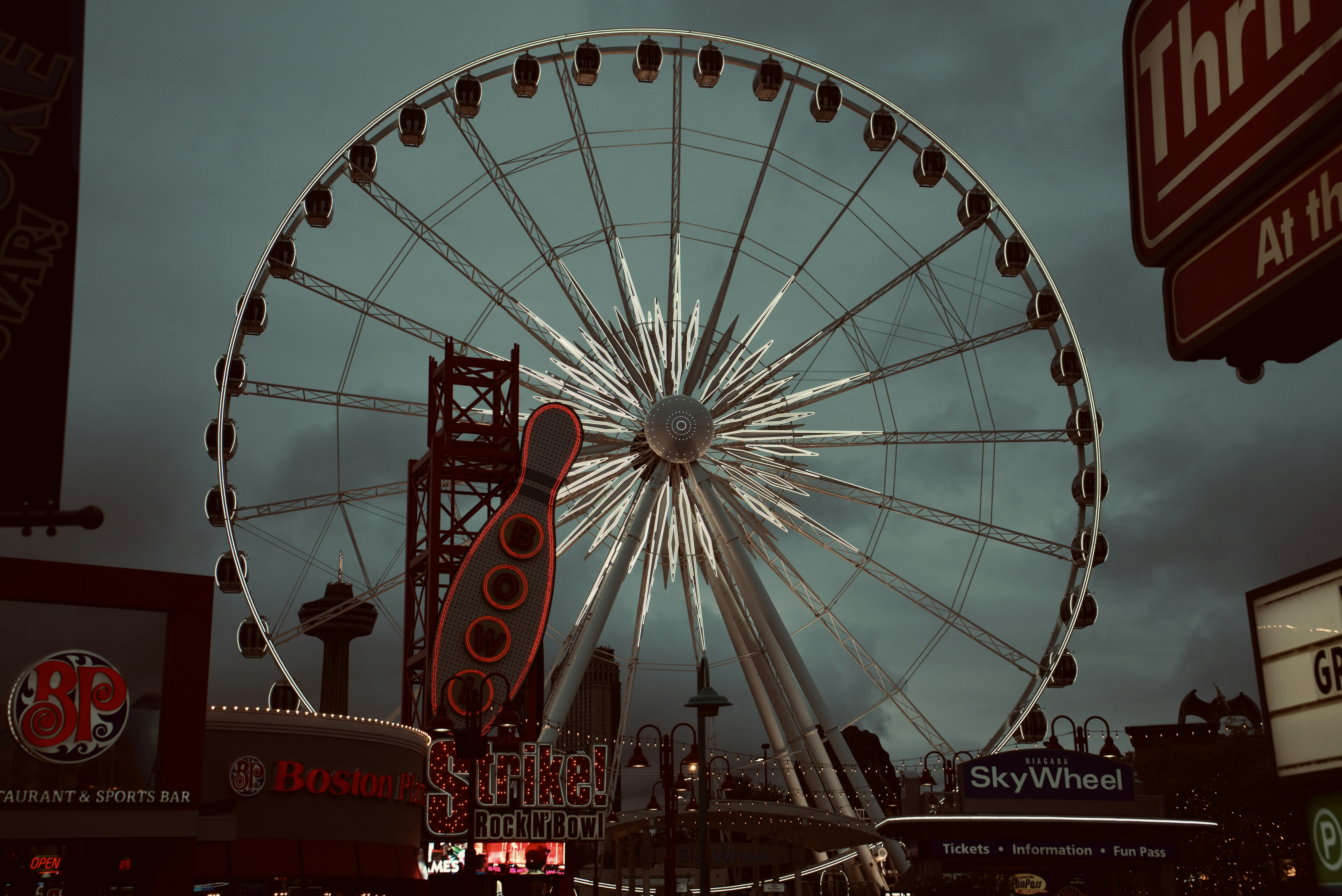 red and white ferris wheel under blue sky during daytime