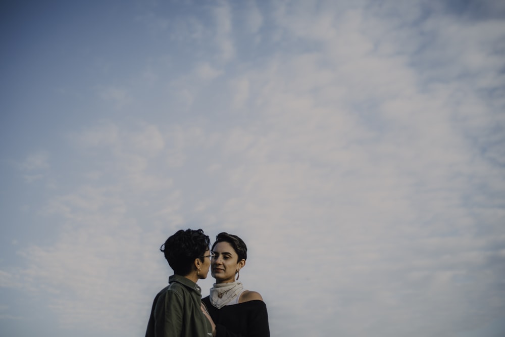 woman in black shirt standing beside woman in black shirt