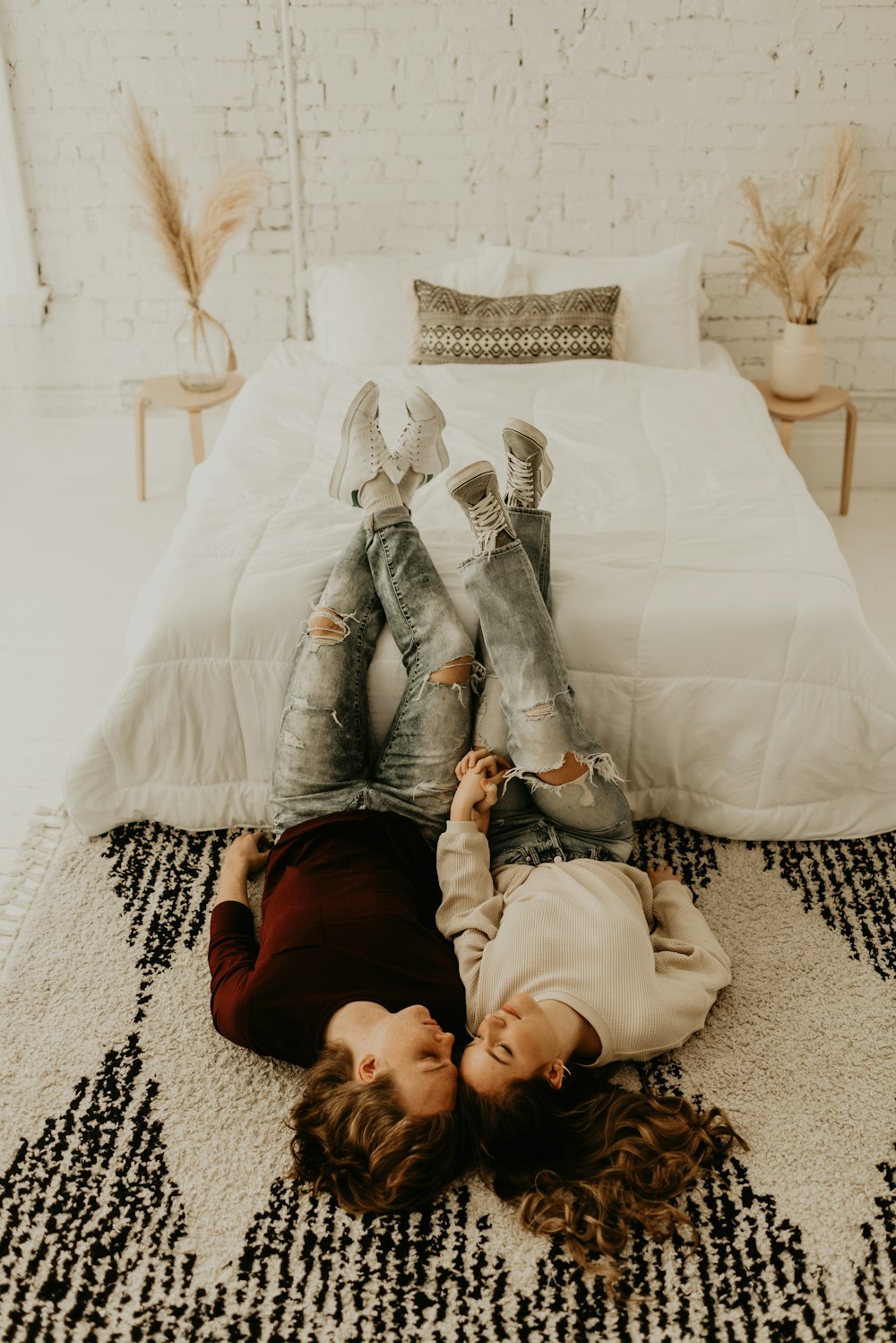 woman in brown long sleeve shirt lying on bed