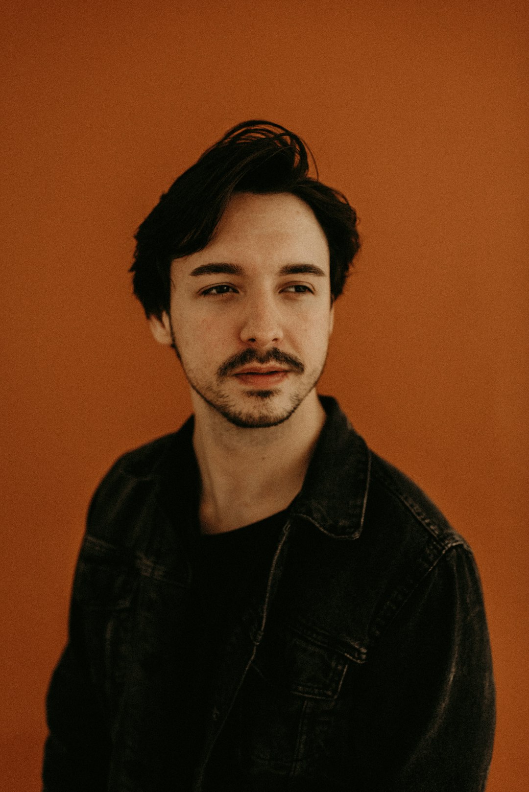 man in black leather jacket