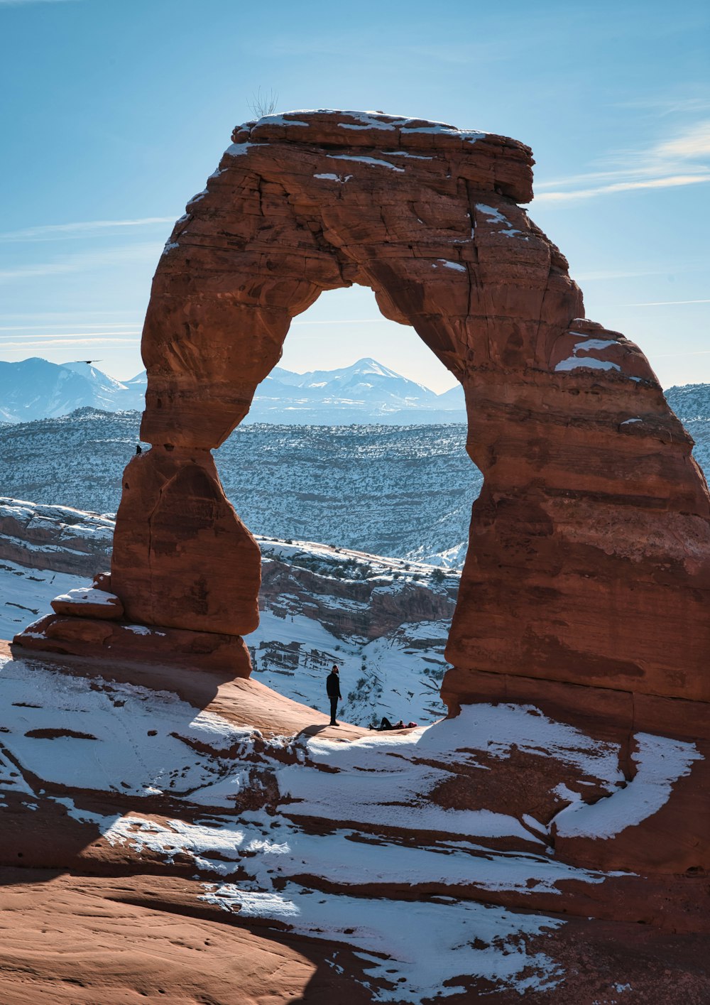 brown rock formation near body of water during daytime