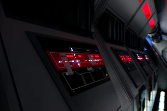 A sleek, modern industrial control panel with glowing circuit lines and machinery in the background.