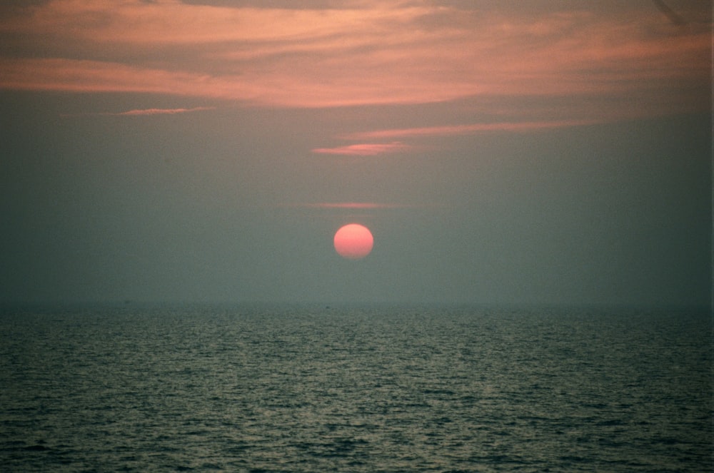 body of water during sunset