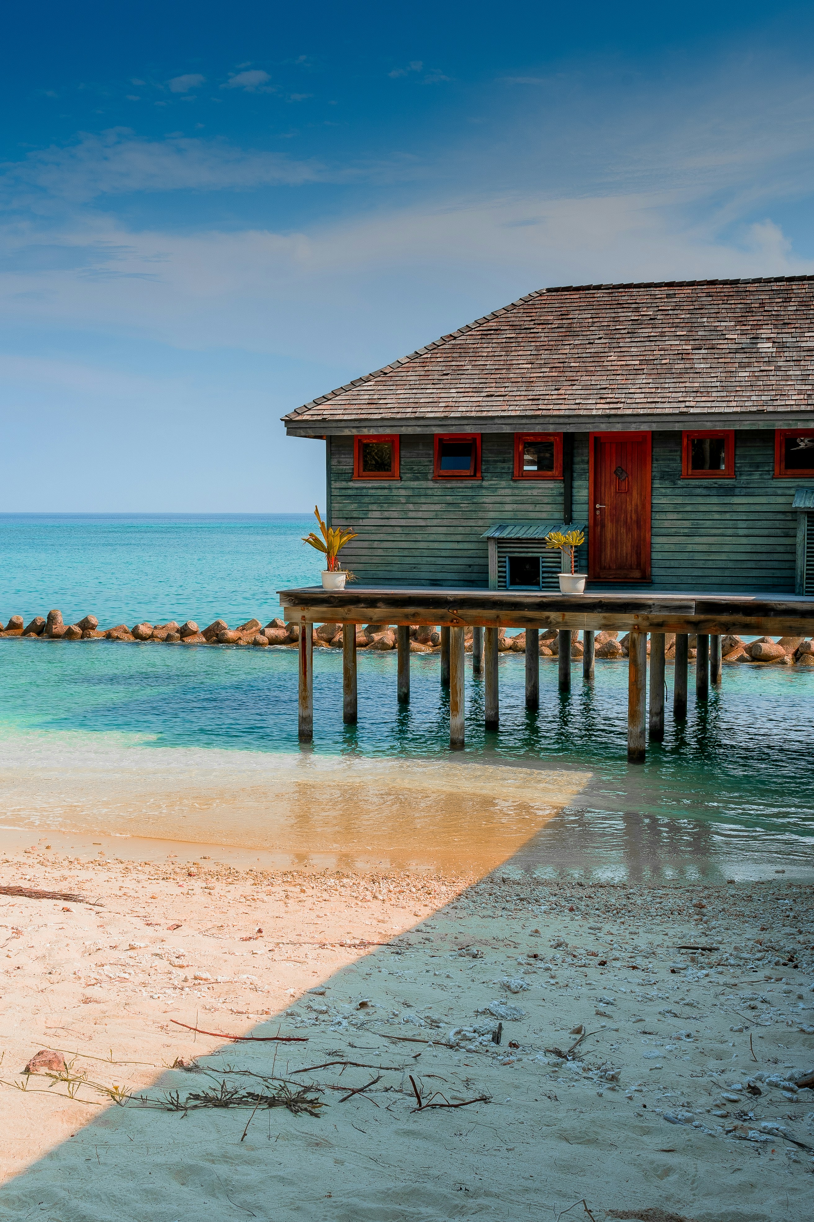 Brown wooden house on beach during daytime photo – Free Ocean house ...