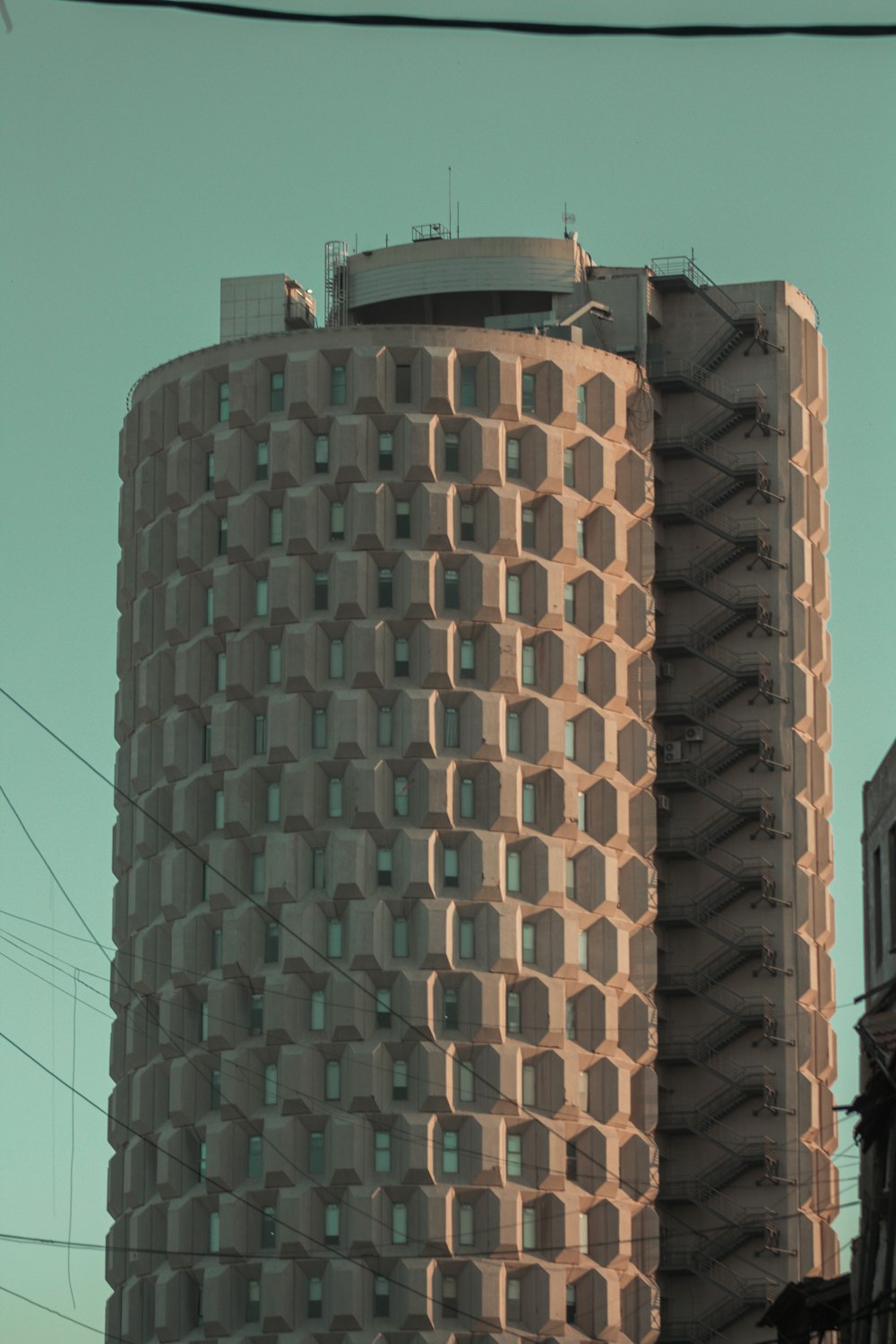 brown and black concrete building under blue sky during daytime