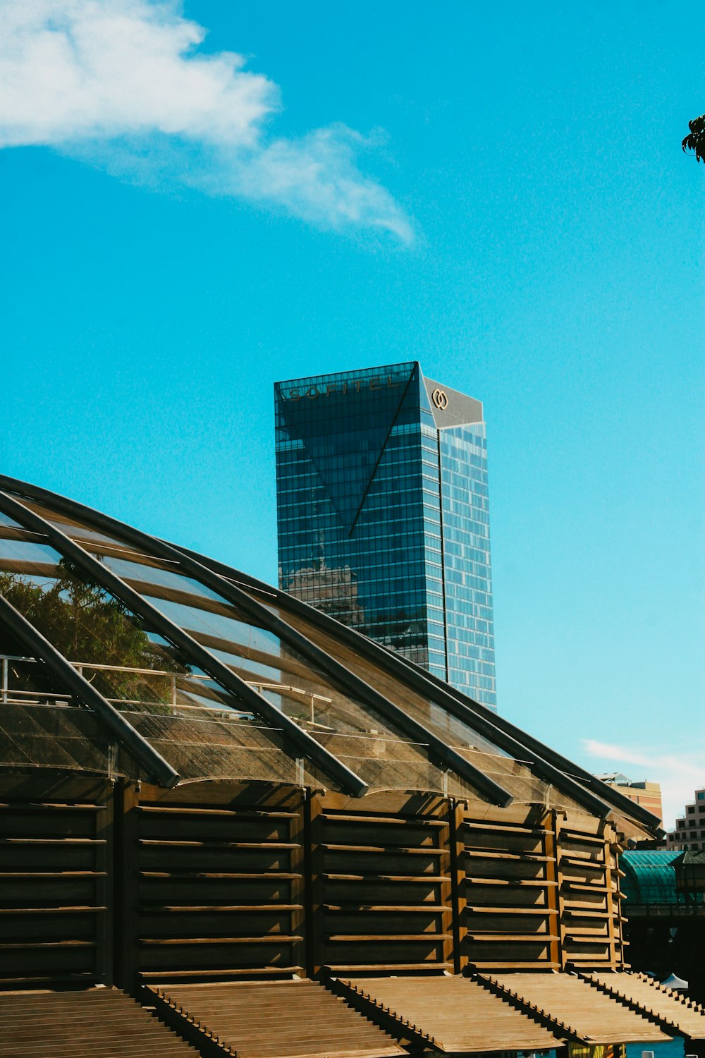 brown wooden stairs near glass building during daytime